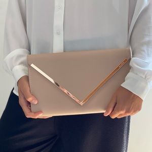 Nude clutch with gold chain from Aldo. 11 inches long. Gold detailing.
